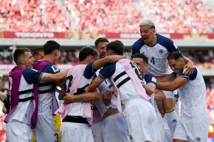TORONTO, ONTARIO - JUNE 12: Jovo Lukic #25 of Bosnia and Herzegovina celebrates with teammates after scoring the team's first goal during the FIFA World Cup 2026 Group B match between Canada and Bosnia and Herzegovina at Toronto Stadium on June 12, 2026 in Toronto, Ontario. (Photo by Maja Hitij - FIFA/FIFA via Getty Images)
