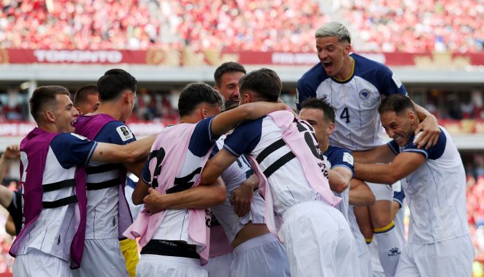 TORONTO, ONTARIO - JUNE 12: Jovo Lukic #25 of Bosnia and Herzegovina celebrates with teammates after scoring the team's first goal during the FIFA World Cup 2026 Group B match between Canada and Bosnia and Herzegovina at Toronto Stadium on June 12, 2026 in Toronto, Ontario. (Photo by Maja Hitij - FIFA/FIFA via Getty Images)