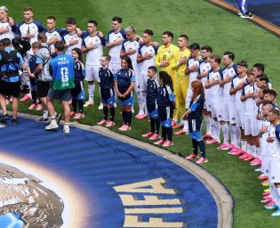 TORONTO, ONTARIO - JUNE 12: Bosnia and Herzegovina players stand for the national anthem before the FIFA World Cup 2026 Group B match between Canada and Bosnia and Herzegovina at Toronto Stadium on June 12, 2026 in Toronto, Ontario. (Photo by Ezra Shaw - FIFA/FIFA via Getty Images)