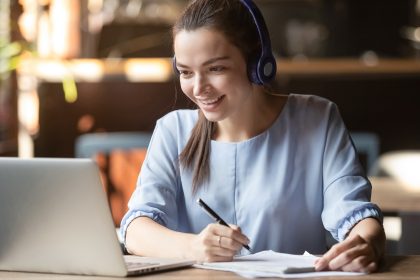 Smiling,Girl,Student,Wear,Wireless,Headphone,Study,Online,With,Skype