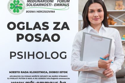 pleased young female cook wearing chef uniform stands and points with hand at nearby white wall isolated on pink background with copy space